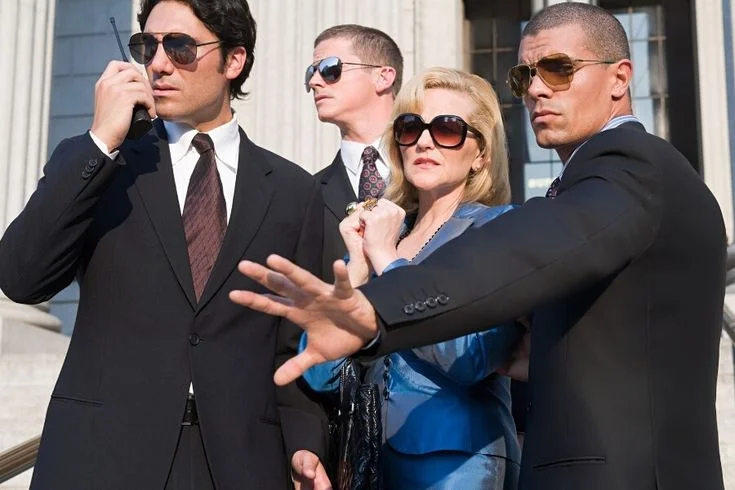 Close protection detail escorting a principal
